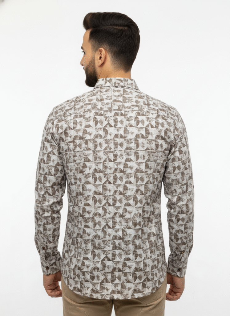 Indian male model wearing a premium black full-sleeve shirt with chest pocket, standing in studio background